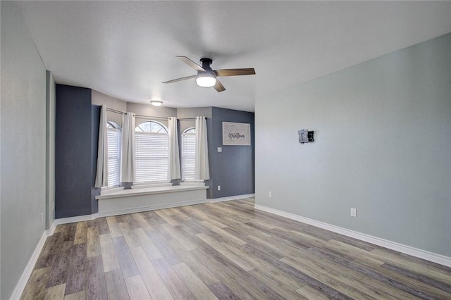 2111 Buckeye Dr, Ingleside, TX 78362 - empty room featuring ceiling fan, wood finished floors, and baseboards
