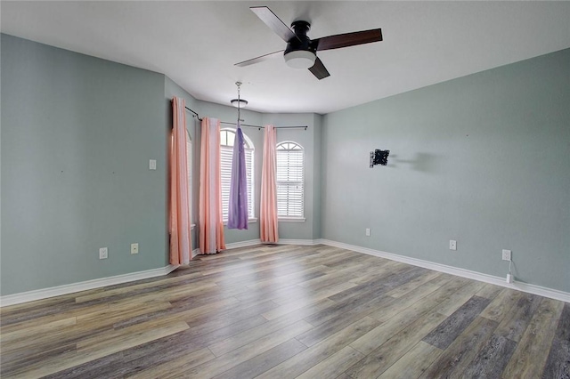 2111 Buckeye Dr, Ingleside, TX 78362 - empty room featuring ceiling fan, wood finished floors, and baseboards