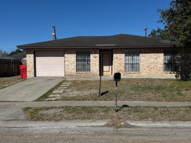 single story home featuring a garage