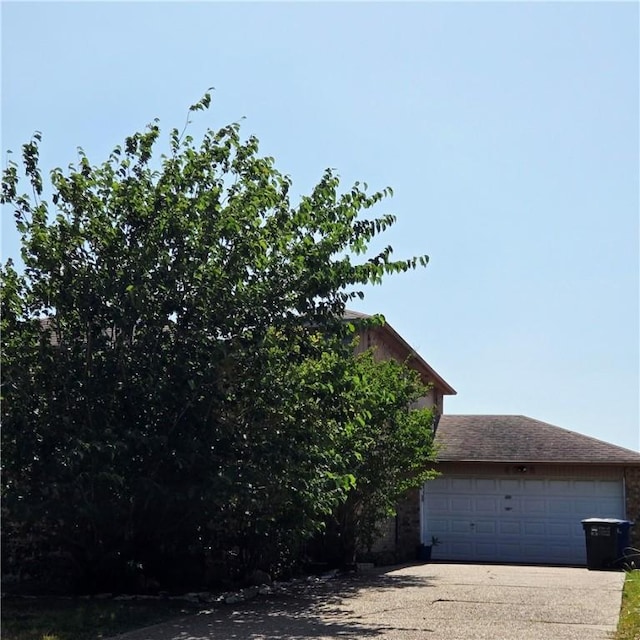 4305 Catfish Dr, Corpus Christi, TX 78410 - view of property exterior featuring concrete driveway and a garage