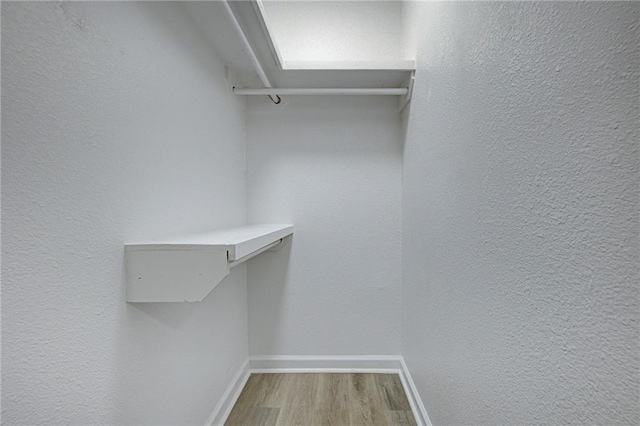 walk in closet featuring light wood-type flooring