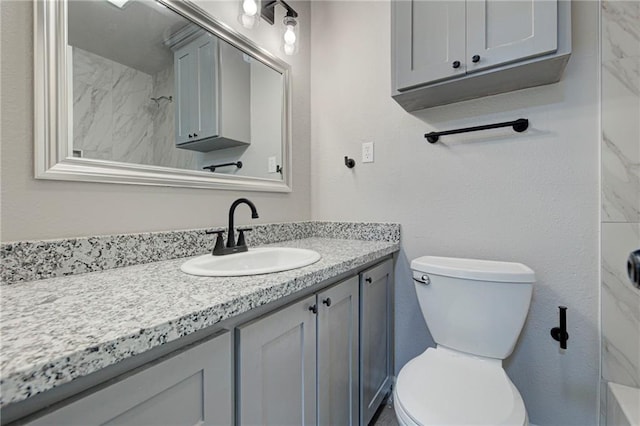 bathroom with toilet and vanity