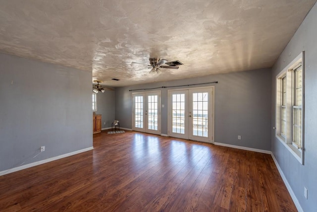 unfurnished room featuring ceiling fan, french doors, and dark hardwood / wood-style flooring