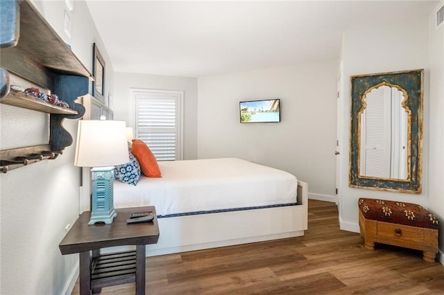 bedroom featuring dark wood-type flooring