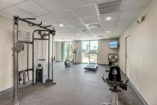 workout area with a drop ceiling