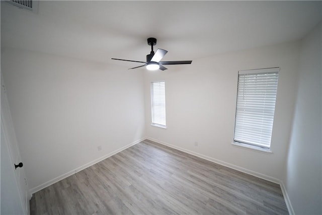 empty room featuring light hardwood / wood-style floors and ceiling fan