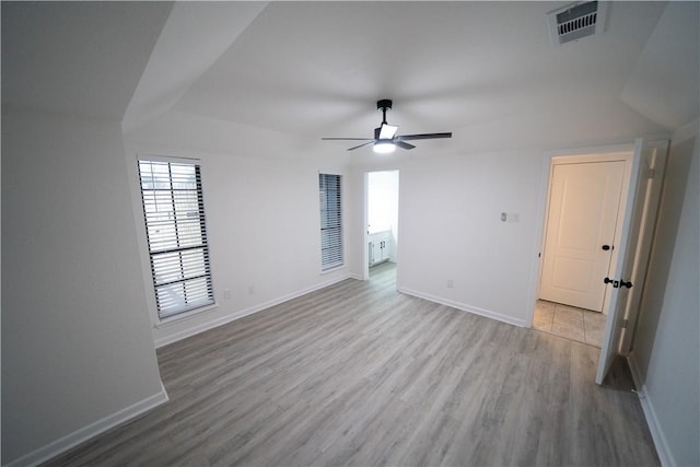 empty room with ceiling fan and light wood-type flooring