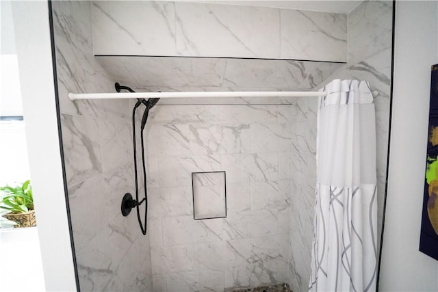 bathroom with a shower with shower curtain