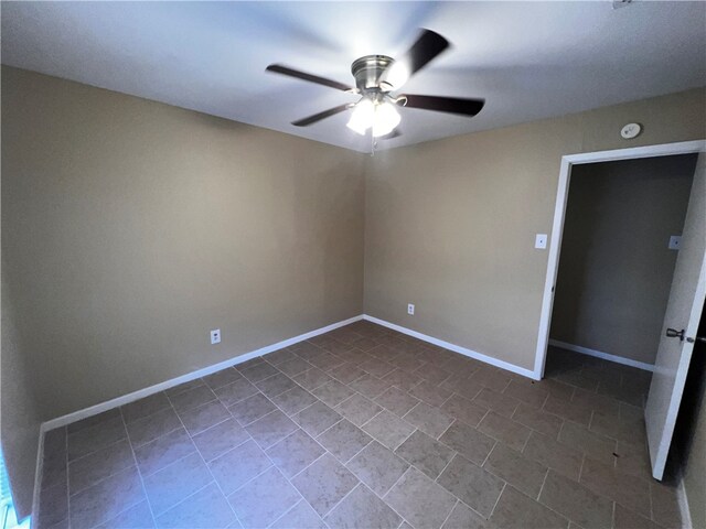 unfurnished room with ceiling fan