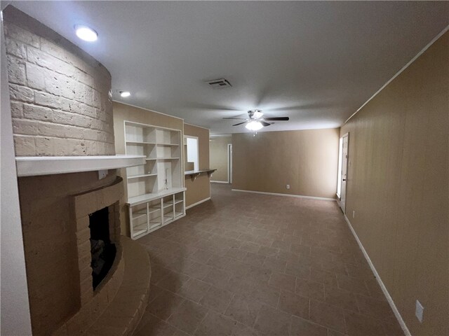 unfurnished living room with ceiling fan