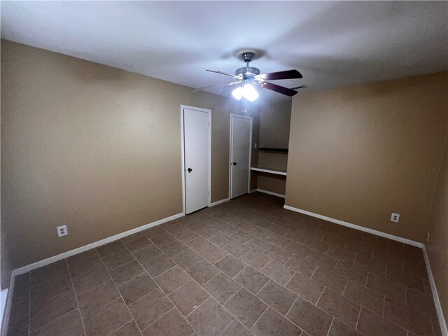 unfurnished bedroom featuring ceiling fan