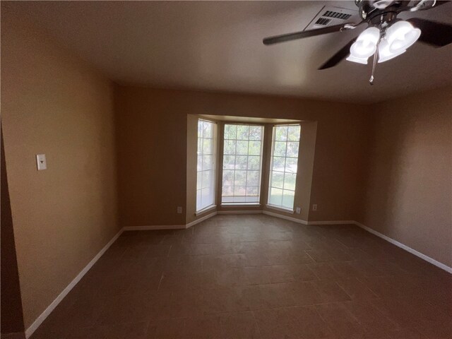 unfurnished room featuring ceiling fan