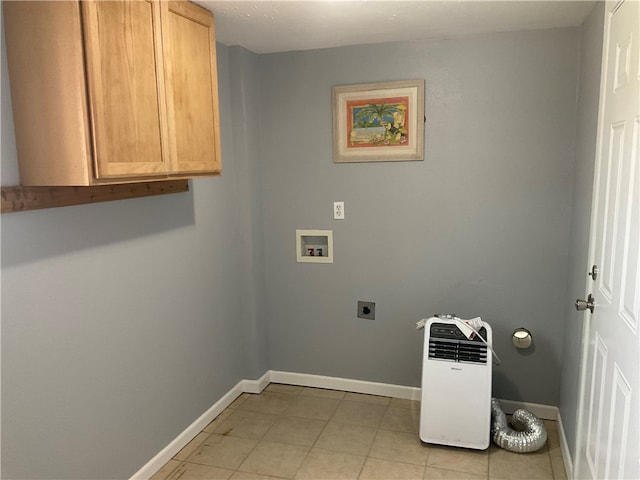 clothes washing area featuring hookup for a washing machine, electric dryer hookup, and cabinets