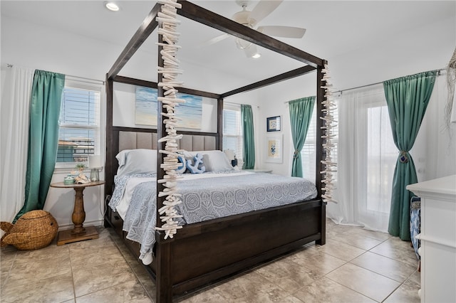 bedroom with multiple windows and ceiling fan