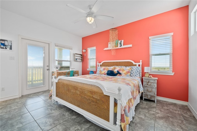 tiled bedroom featuring ceiling fan and access to exterior