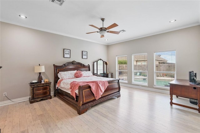 bedroom featuring light wood-style floors, crown molding, baseboards, recessed lighting, and a ceiling fan
