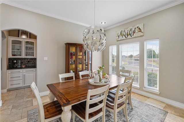 dining area with ornamental molding, baseboards, a chandelier, recessed lighting, and stone tile floors