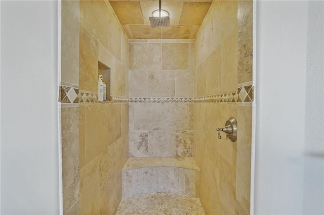full bath with tiled shower