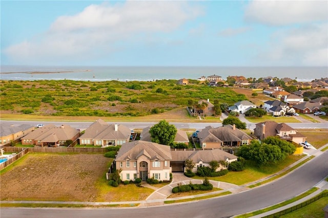 aerial perspective of suburban area with a large body of water