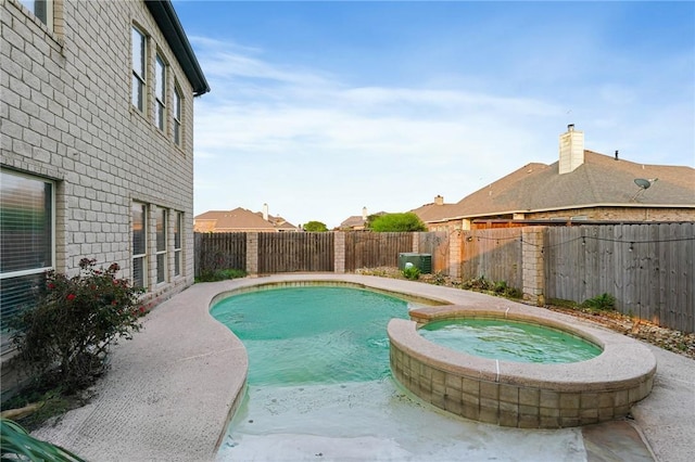 view of pool featuring a pool with connected hot tub, a fenced backyard, and cooling unit