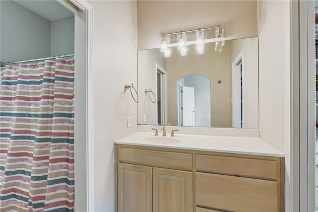 bathroom featuring vanity and a shower with shower curtain