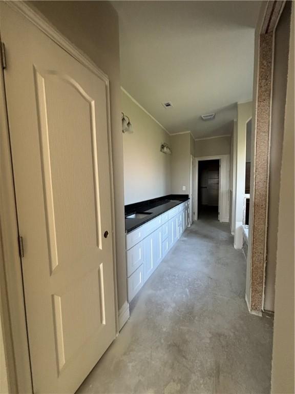 full bath featuring a tub to relax in and unfinished concrete flooring