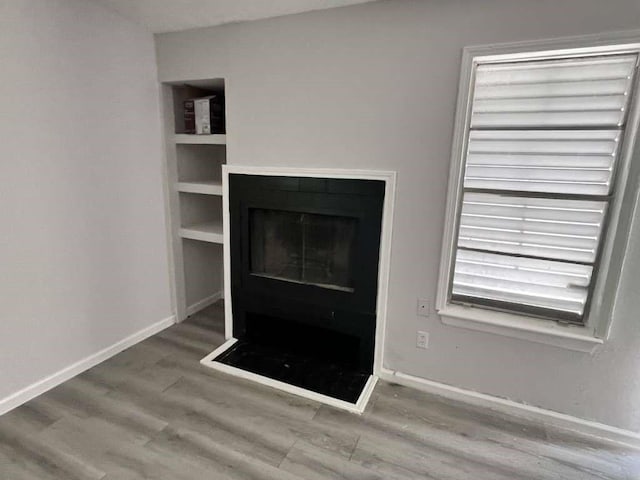 7206 Elwood Ct Unit A4, Corpus Christi, TX 78413 - detailed view of wood finished floors and a fireplace