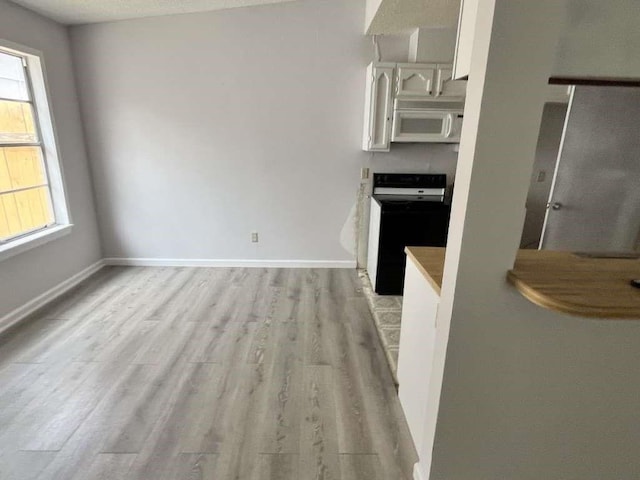 7206 Elwood Ct Unit A4, Corpus Christi, TX 78413 - unfurnished dining area featuring light wood-type flooring