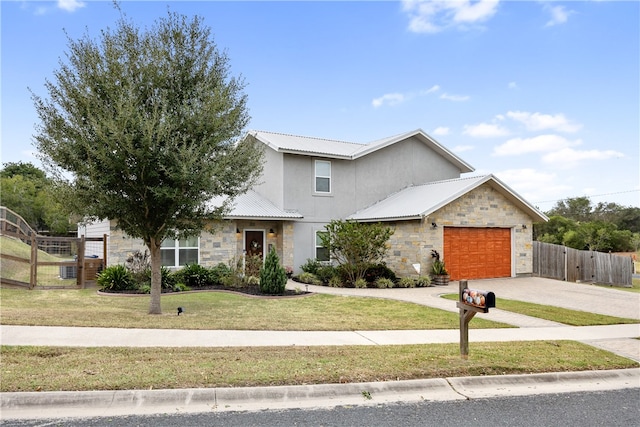 view of front of home with a garage and a front yard