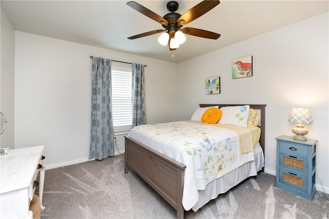 bedroom featuring light colored carpet and ceiling fan