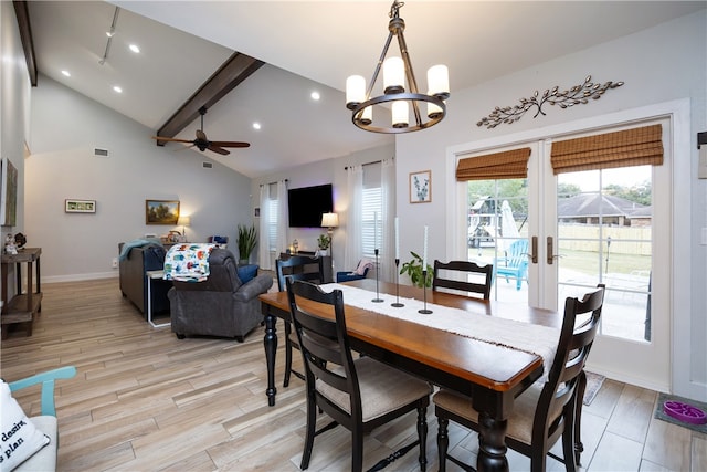 dining room with french doors, beam ceiling, high vaulted ceiling, light hardwood / wood-style floors, and ceiling fan with notable chandelier