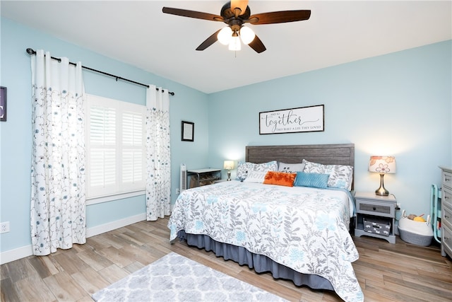 bedroom featuring light wood-type flooring and ceiling fan