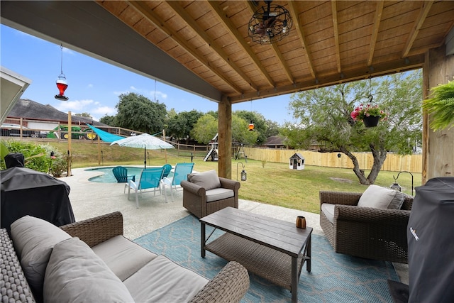 view of patio featuring an outdoor hangout area and a fenced in pool