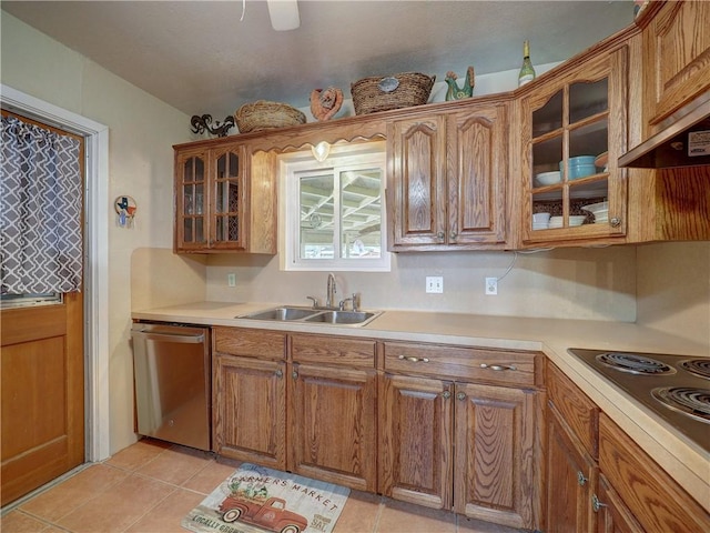 kitchen featuring sink, light tile patterned floors, electric cooktop, custom exhaust hood, and stainless steel dishwasher