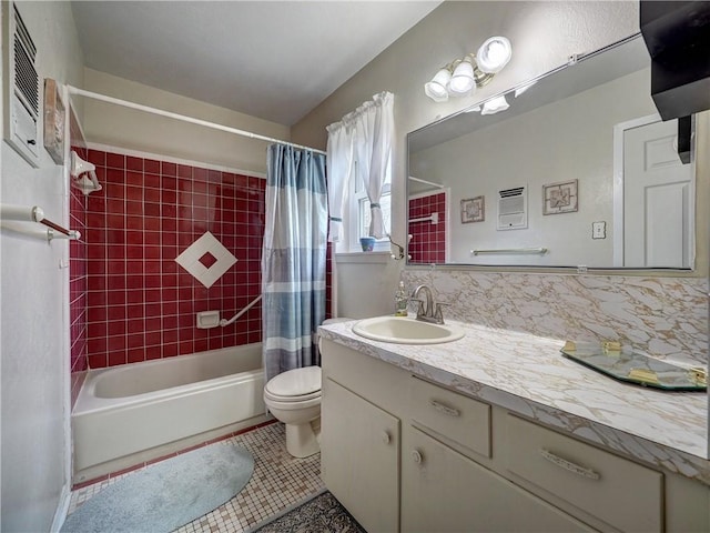 full bathroom with tile patterned floors, toilet, tasteful backsplash, shower / tub combo, and vanity