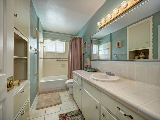 full bathroom with toilet, vanity, shower / bath combination with curtain, tile patterned flooring, and decorative backsplash