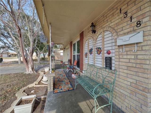 view of patio featuring a porch