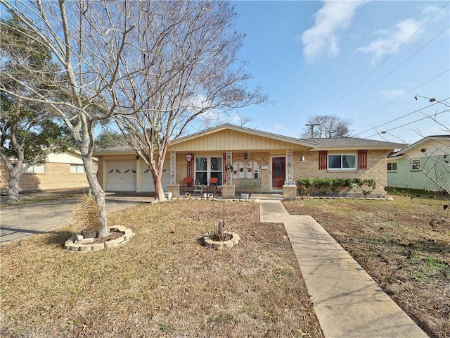 ranch-style house with a garage, covered porch, and a front lawn