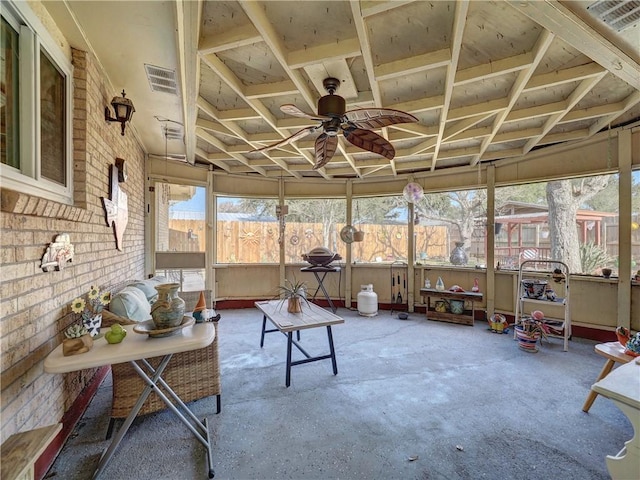 sunroom / solarium featuring ceiling fan