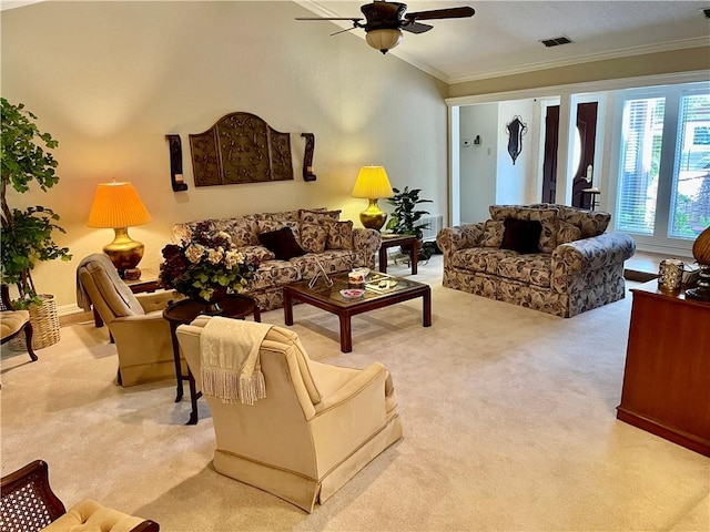 living room featuring light carpet, ceiling fan, and crown molding