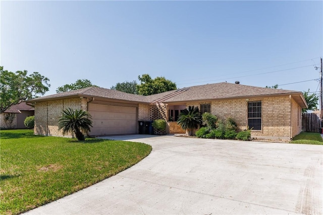 4119 Crenshaw Dr, Corpus Christi, TX 78413 - ranch-style house featuring driveway, a front yard, an attached garage, and brick siding