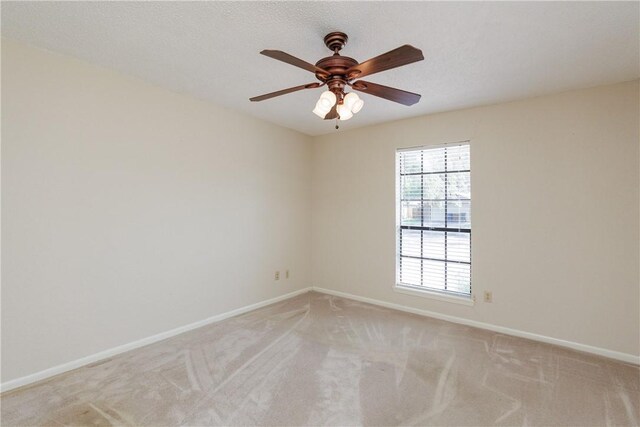 4119 Crenshaw Dr, Corpus Christi, TX 78413 - empty room with light colored carpet, baseboards, and ceiling fan