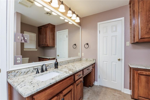 4119 Crenshaw Dr, Corpus Christi, TX 78413 - bathroom featuring vanity, toilet, and baseboards