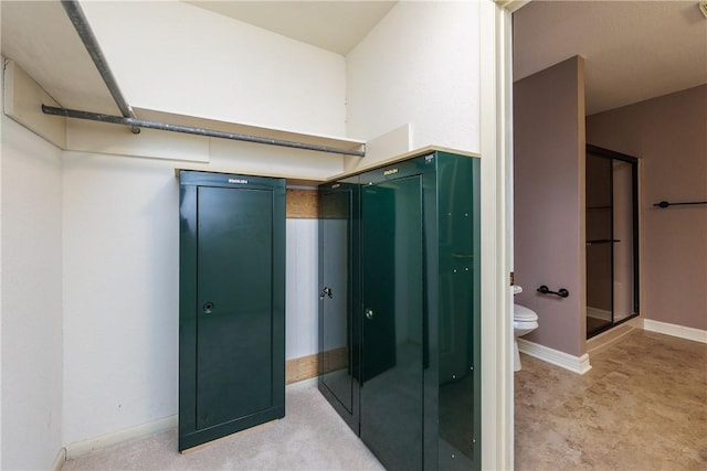 4119 Crenshaw Dr, Corpus Christi, TX 78413 - bathroom with toilet, a shower stall, and baseboards