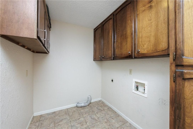 4119 Crenshaw Dr, Corpus Christi, TX 78413 - washroom featuring cabinet space, electric dryer hookup, hookup for a washing machine, baseboards, and a textured ceiling