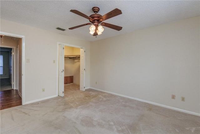 4119 Crenshaw Dr, Corpus Christi, TX 78413 - unfurnished bedroom featuring attic access, carpet flooring, a spacious closet, baseboards, and a textured ceiling