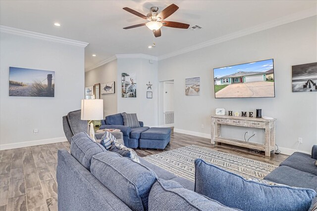 living room with ceiling fan, wood-type flooring, and ornamental molding