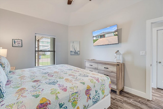 bedroom featuring hardwood / wood-style flooring and ceiling fan