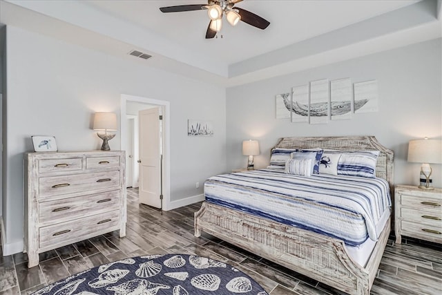 bedroom featuring ceiling fan and dark hardwood / wood-style floors