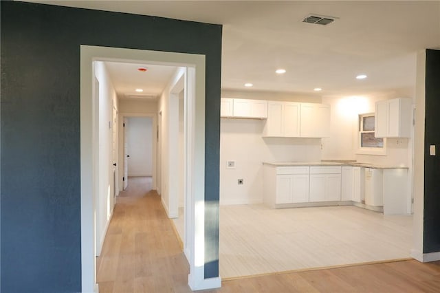 1204 Rose Dr, Alice, TX 78332 - hallway featuring light wood-style floors, baseboards, and recessed lighting